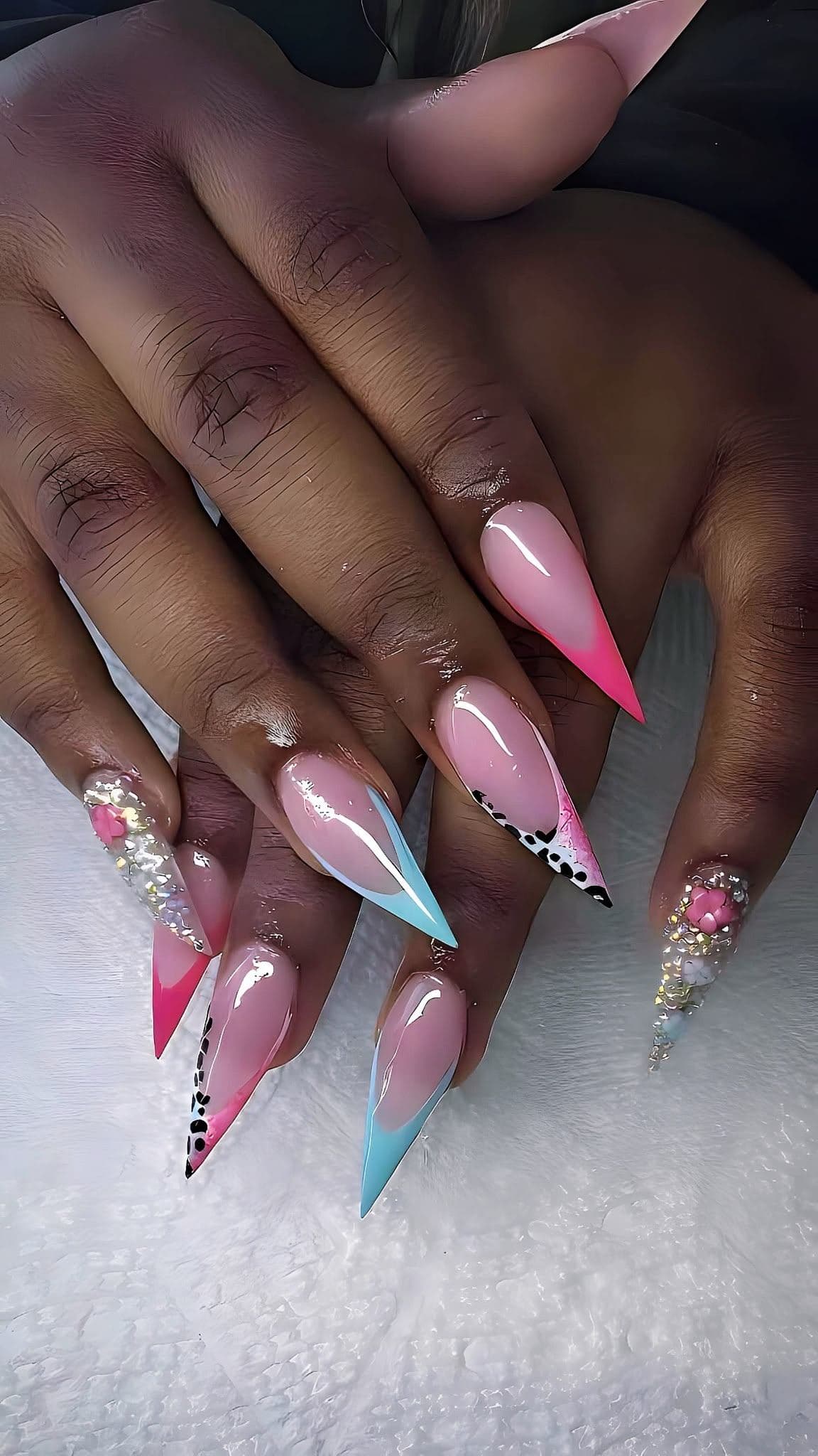 Stiletto set with pink and blue french tips, leopard print, and crystal accents